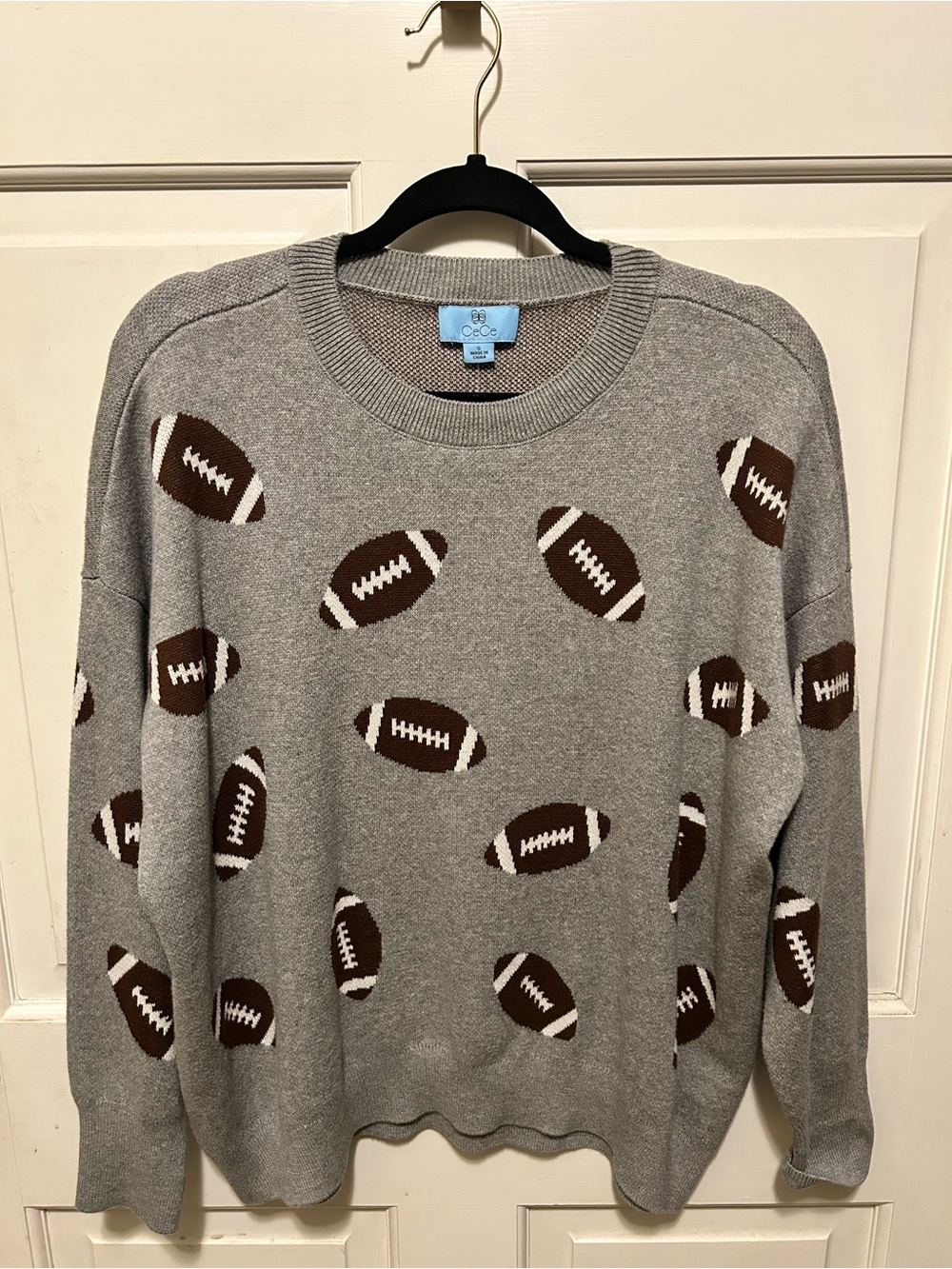 CeCe Gray Crewneck Sweater with Brown Footballs